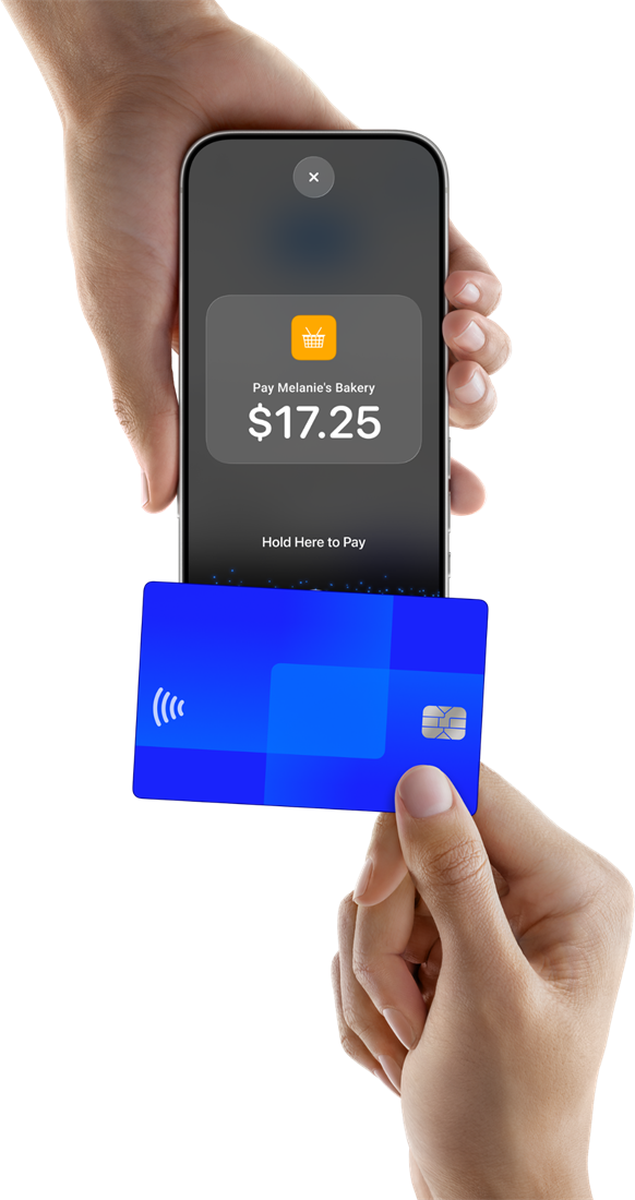A customer holding a contactless card to a phone that reads Pay Melanie's Bakery $17.25, Hold Here to Pay